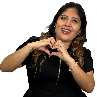Mayra Toribio, Scheduling Coordinator at Dental Group of Westchester, smiling and forming a heart shape with her hands, representing care and compassion in dental services.