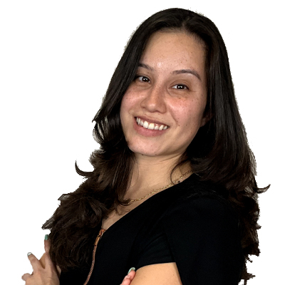 Michelle Estrada, Head Dental Assistant at Dental Group of Westchester, smiling confidently with arms crossed, showcasing a welcoming demeanor.